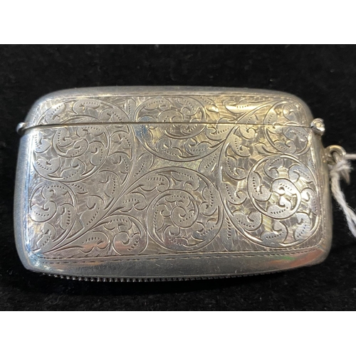 179 - A antique hallmarked for Birmingham 1913 silver card case with ornate engraving and a blank cartouch... 