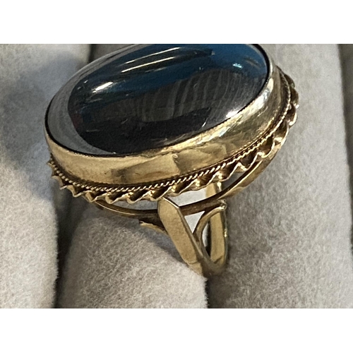 239 - A 9ct gold and polished stone ring size L 13g