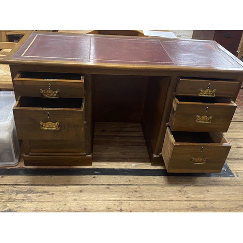 258 - A antique circa 1910 knee hole desk with two pairs of graduated drawers and leather insert,with Art ... 