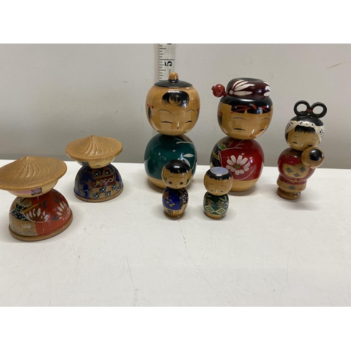 335 - Seven assorted Japanese Kokeshi wooden dolls