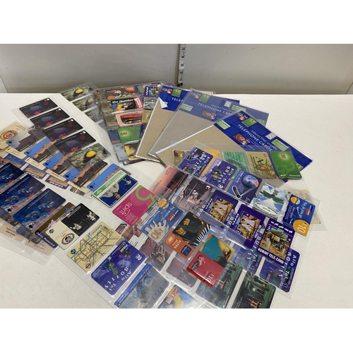 338 - Twelve sheets of used phone cards