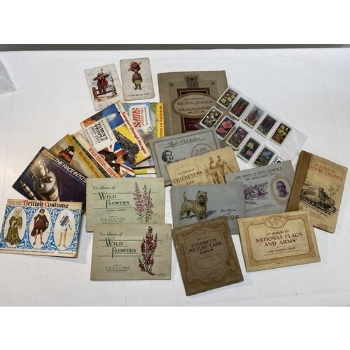 322 - A selection of assorted cigarette card albums and tea card albums