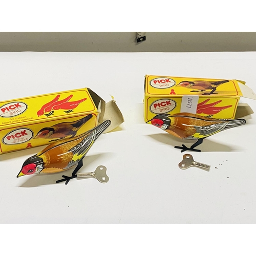 44 - Two boxed vintage clockwork bird toys