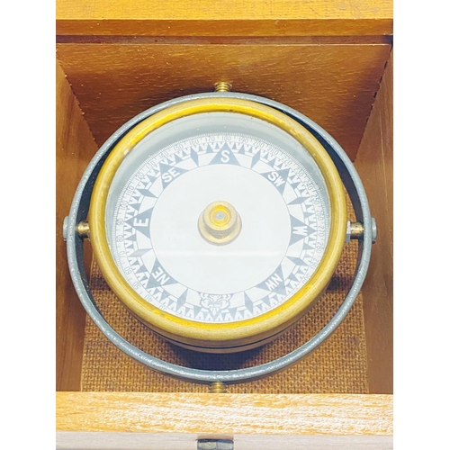 146 - A boxed ships gimbal compass