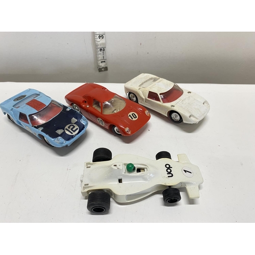 132 - Four assorted vintage slot cars