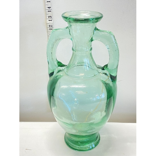 135 - A large antique green glass amphora 36cm tall. No shipping