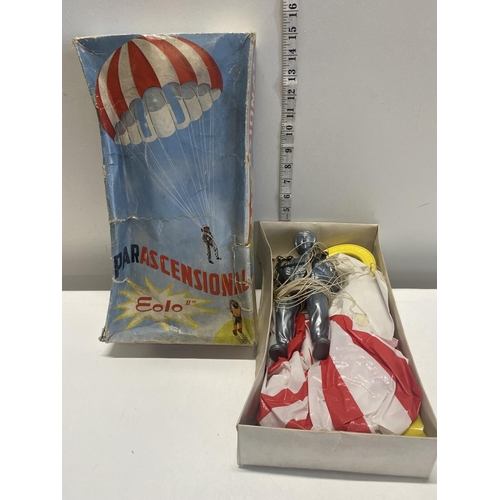 17 - A vintage boxed parachutist toy.