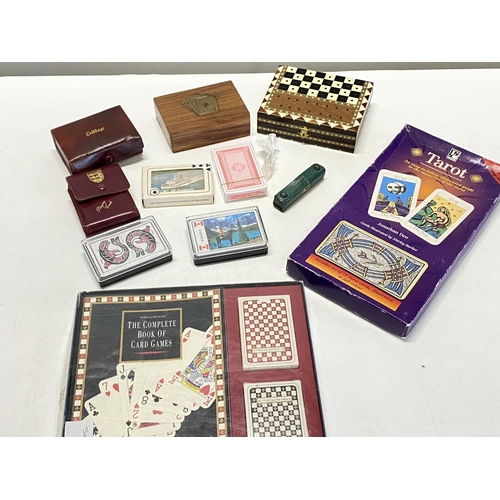 174 - A selection of vintage playing cards & board games etc.