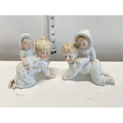 180 - Two antique ceramic figures.