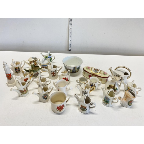 181 - A selection of assorted commemorative/crested ware, mainly watering cans etc.  no shipping