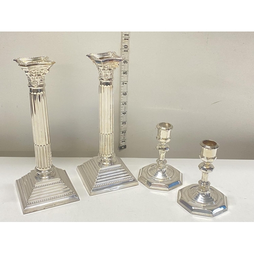 214 - Two quality pairs of silver plated candlesticks