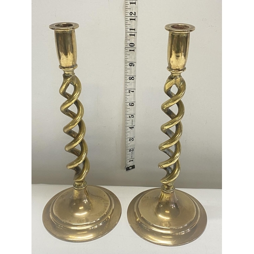 217 - A pair of Victorian brass candlesticks