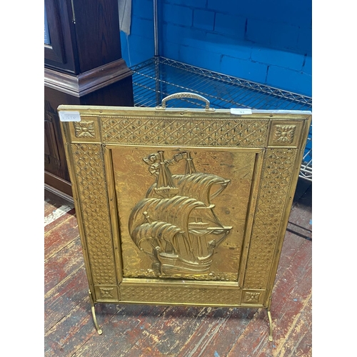 91 - A vintage brass fronted fire screen.  no shipping