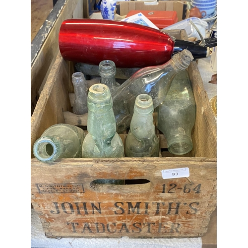 93 - A vintage John Smiths wooden crate & contents of antique bottles etc.  no shipping