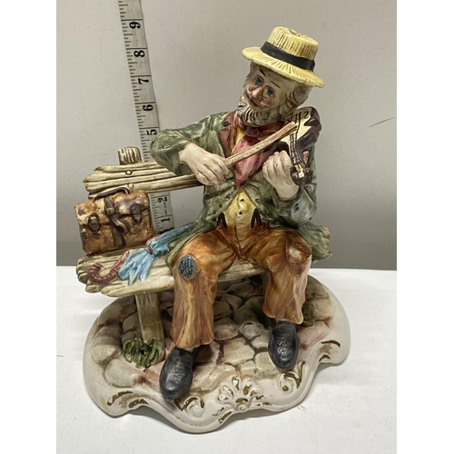 35 - A Capodimonte figure, shipping unavailable