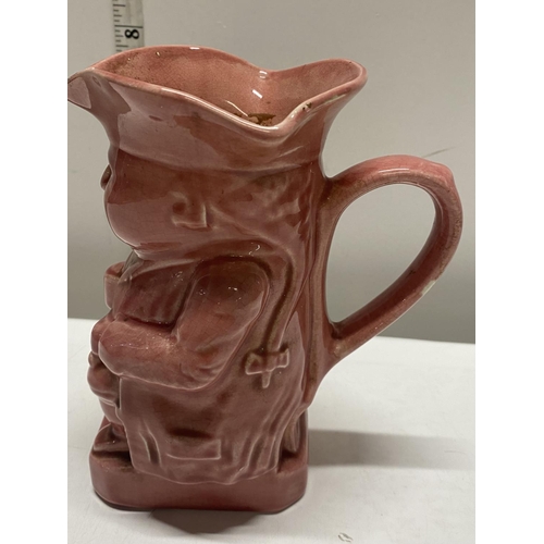 95 - A antique pink glazed character jug stamped No 1 to base, shipping unavailable