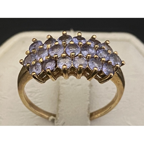 156B - A 9ct gold ring set with three rows of amethysts size V1/2 4.12g