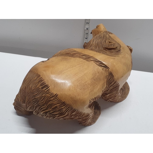 48 - A large heavy hand carved bear figure approx 40x23cm