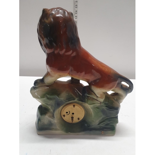 58 - A antique German ceramic lion table clock 28x32cm, shipping unavailable