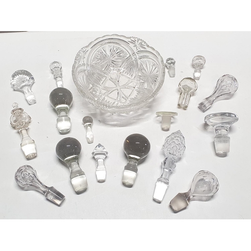 34 - A vintage cut glass bowl with a job lot of assorted glass decanter stoppers, shipping unavailable