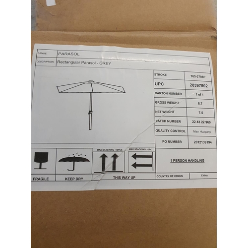 381 - A boxed Marks and Spencer's parasol (unchecked), shipping unavailable