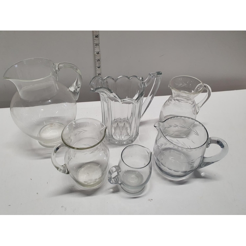 41 - A job lot of vintage and antique glass jugs, shipping unavailable