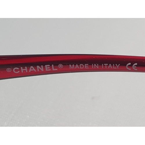 8 - A pair of original Chanel sunglasses in leather case