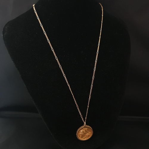 81 - A 1980 22ct gold full sovereign set in a 9ct gold mount & 9ct chain. Total weight 12.83 grams.