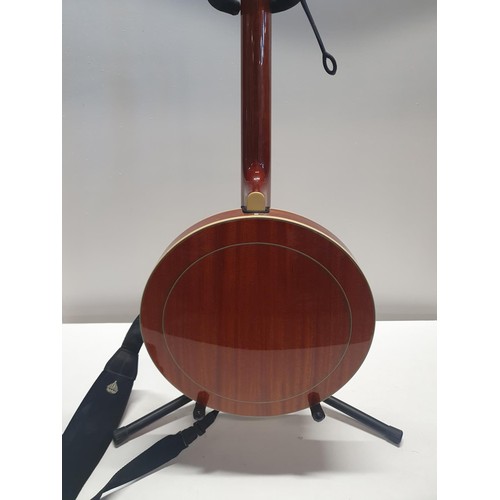 181 - A Richwood RBJ-705 banjo with stand, shipping unavailable