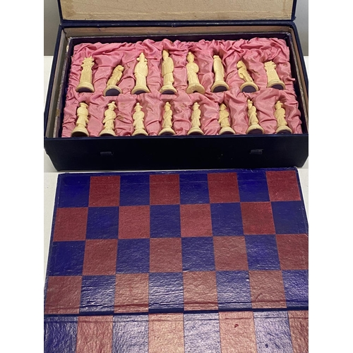 114 - A boxed vintage Chinese themed chess set (complete) with board