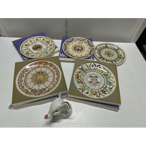 32 - A selection of Wedgwood year plates and a Wedgwood elephant, shipping unavailable