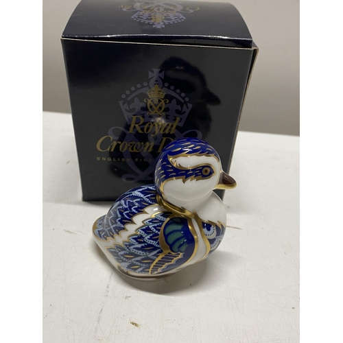 82 - A boxed Royal Crown Derby paperweight 'Sitting Duckling' with silver stopper