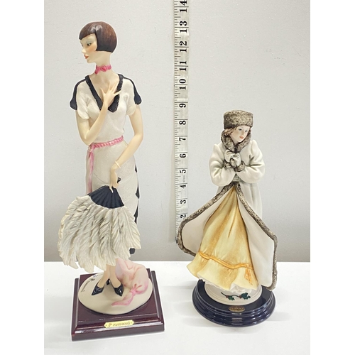 107 - Two G Armani figurines, shipping unavailable