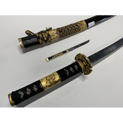 203 - A well made reproduction Japanese Katana sword with scabbard and matching Kozuka knife, shipping una... 