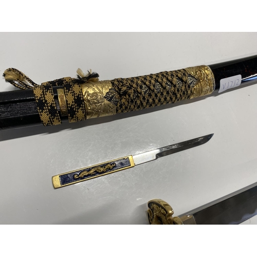 203 - A well made reproduction Japanese Katana sword with scabbard and matching Kozuka knife, shipping una... 