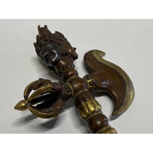 205 - A heavy antique ritual Tibetan iron and gilt bronze Vajra Kartika Phurba dagger with finely cast ima... 