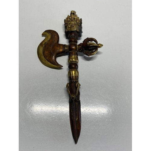 205 - A heavy antique ritual Tibetan iron and gilt bronze Vajra Kartika Phurba dagger with finely cast ima... 