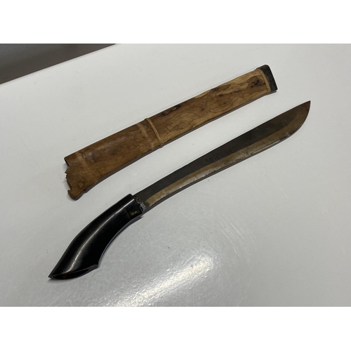 206 - A antique south east asian horn handled machete in wood scabbard, shipping unavailable