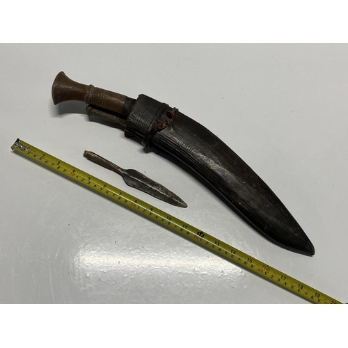 208 - An antique Kukri knife in leather scabbard with skinning knife and a unusual antique spear head (UK ... 