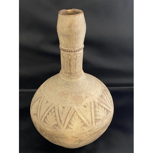 224 - A circa 12th century Abbasid Dynasty (modern day Bagdad) clay vase with hand work foliage decoration... 