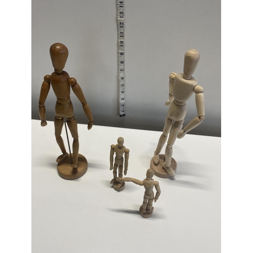 153 - A selection of wooden articulated artists mannequins tallest 34cm