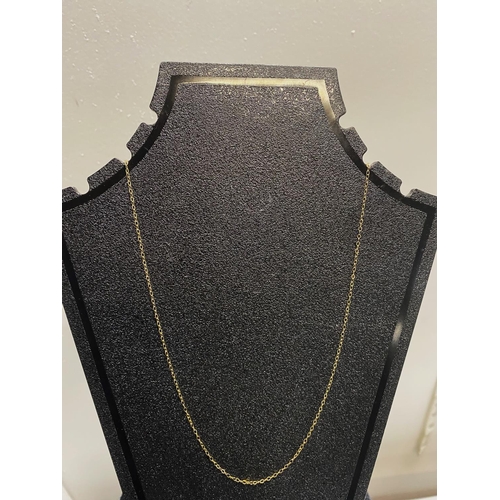 124 - A 9ct gold chain. 0.38 grams.