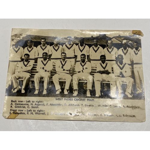 103 - A 1957 West Indies cricket team photo with players signatures to reverse