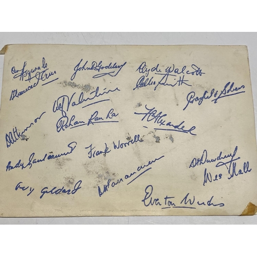 103 - A 1957 West Indies cricket team photo with players signatures to reverse