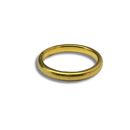 129 - A 22ct gold band ring 3.83 size W