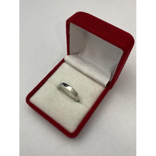 135 - A 18ct white gold band ring 3.63 grams. Size K