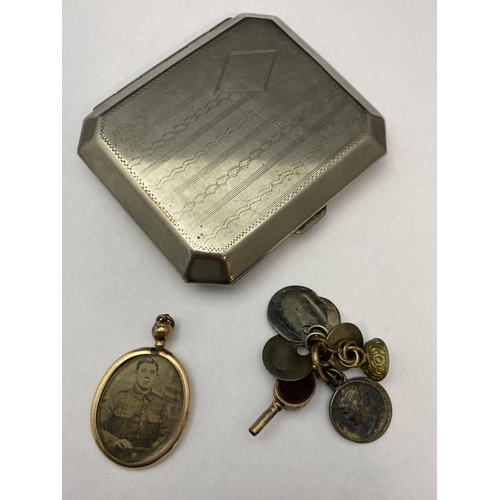 140 - A vintage cigarette case, gold tone pendant and other