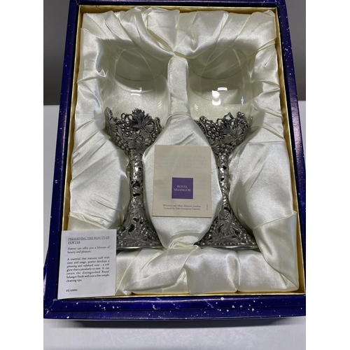 17 - A boxed set of Royal Selangore wine glasses