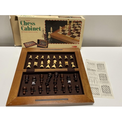 290 - A chess cabinet complete with pieces