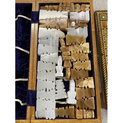 309 - Three assorted chess boards with matching pieces